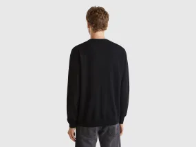 Black crew neck sweater in pure Merino wool - Black | Benetton