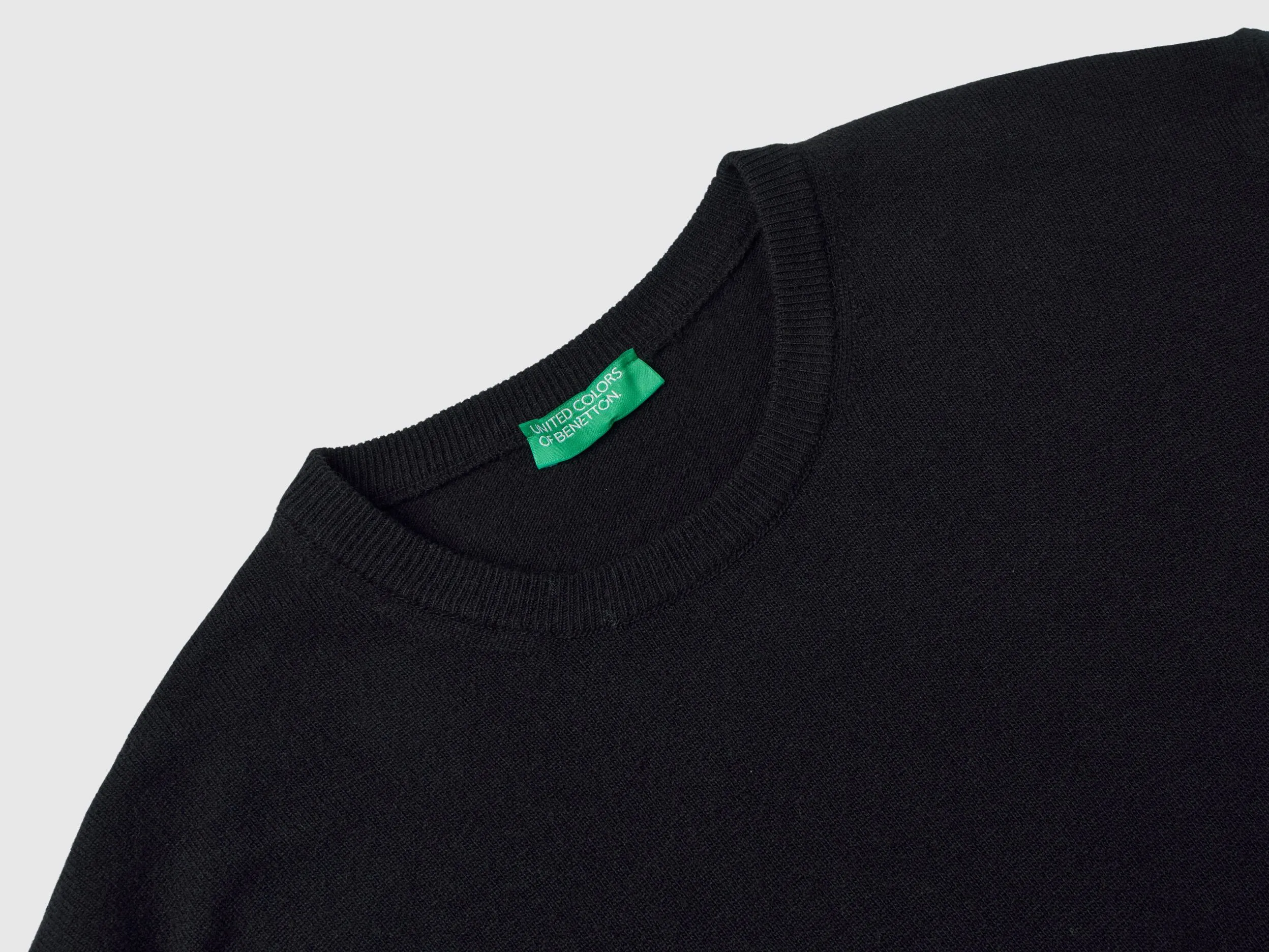 Black crew neck sweater in pure Merino wool - Black | Benetton